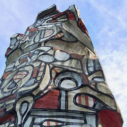 Low angle view of tower against blue sky