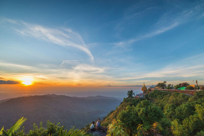 Scenic view of landscape against sky during sunset