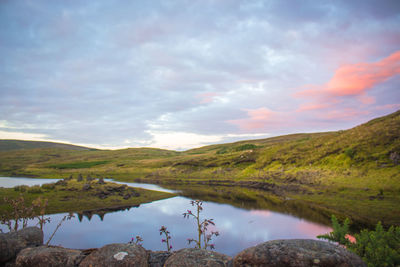 Scenic view of lake against sky during sunset