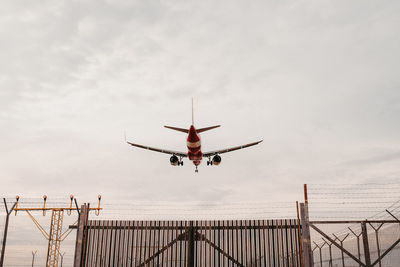 Low angle view of airplane flying in sky