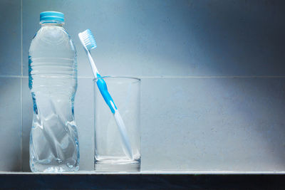Blue glass bottle on water