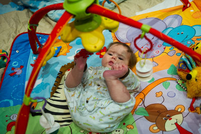 Cute girl playing with toys