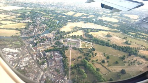 Aerial view of city seen through airplane window