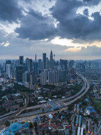 High angle view of modern buildings in city against sky