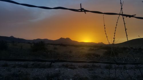 Scenic view of landscape against sky during sunset