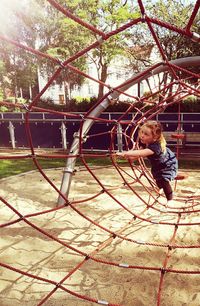 Full length of girl on swing in park