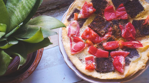High angle view of strawberries in plate on table