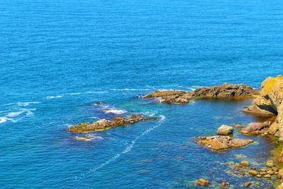 High angle view of rock formation in sea