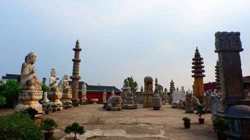 Statue of historic building against sky