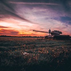 Sit on an tank and enjoy the sunset.