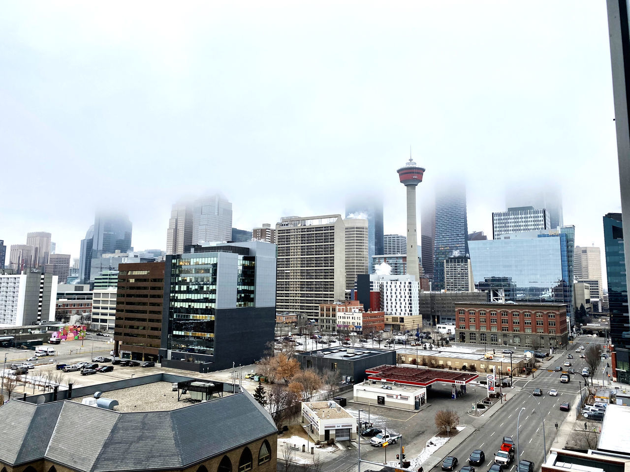 HIGH ANGLE VIEW OF STREET AMIDST BUILDINGS IN CITY