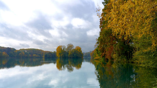Scenic view of lake against sky during autumn