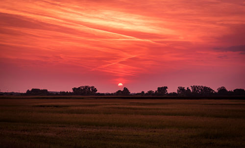 Scenic view of landscape against sky during sunset