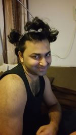 Portrait of smiling woman at home