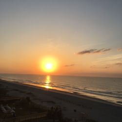 Scenic view of sea against sky at sunset