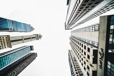 Low angle view of skyscrapers against clear sky