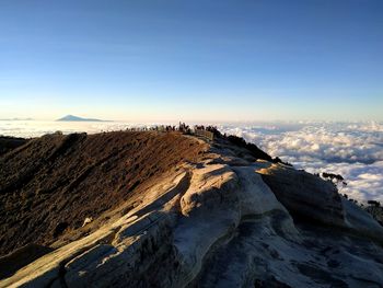 Scenic view of snowcapped mountains against blue sky