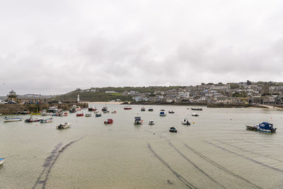 High angle view of beach by buildings against sky