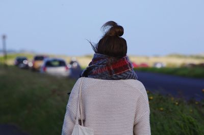 Rear view of woman against sky