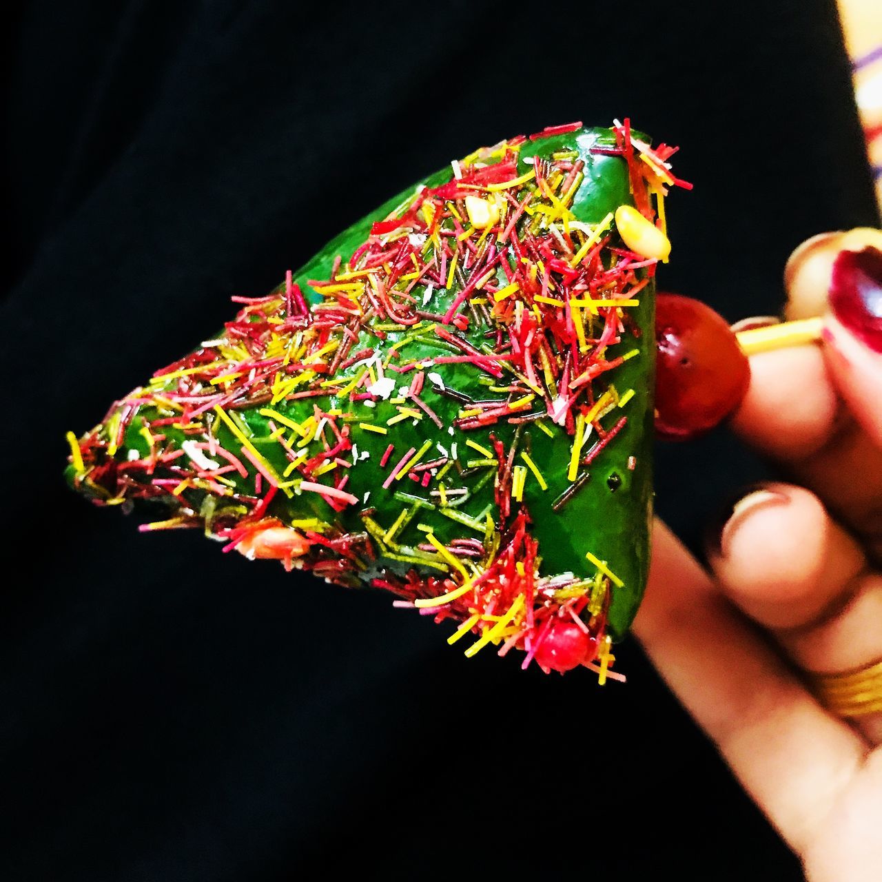 close-up, human body part, human hand, hand, plant, one person, holding, flower, unrecognizable person, nature, focus on foreground, black background, real people, flowering plant, freshness, body part, beauty in nature, finger, human finger, green color, outdoors, flower head