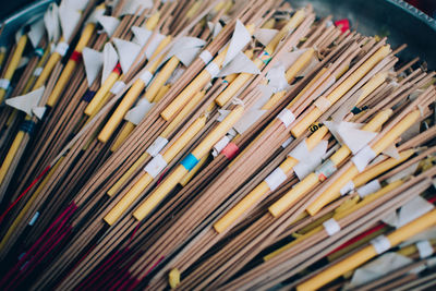 Close-up of incense stick with candle in store