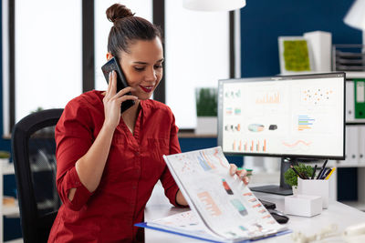 Young businesswoman working in office