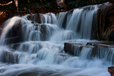 Scenic view of waterfall in forest