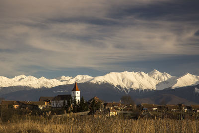 Scenic view of snowcapped mountains against sky