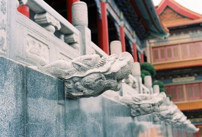 Low angle view of statue against building