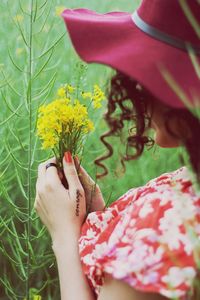 Close-up of hand holding flower