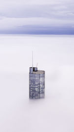 Trump tower during against cloudy sky foggy weather