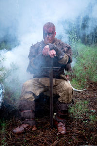 Man sitting in the forest