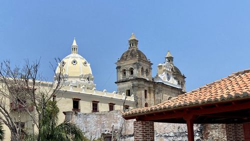 Low angle view of a building against clear blue sky