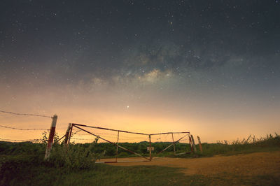 Scenic view of field against sky at night