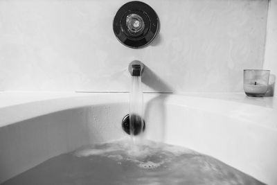 Close-up of bathtub in bathroom at home