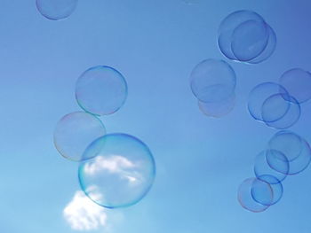 Low angle view of bubble against sky