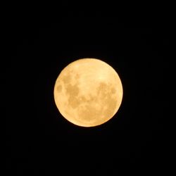 Low angle view of moon against sky at night