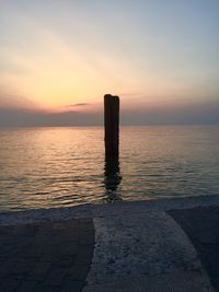 Scenic view of sea against sky at sunset