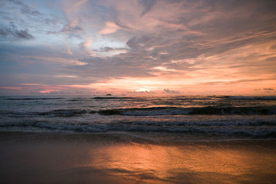 Scenic view of sea against dramatic sky