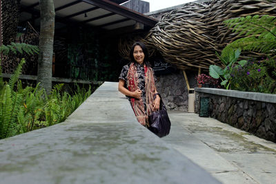 Full length of woman on footpath