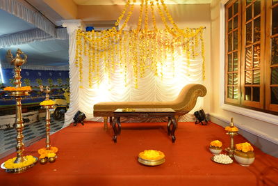 Rear view of woman sitting on table