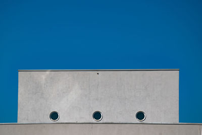 Low angle view of building against blue sky