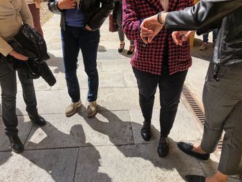 Low section of people on footpath in city