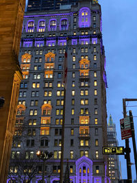 Low angle view of illuminated building at night