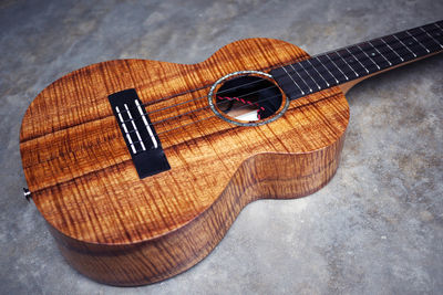 High angle view of guitar on table