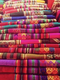 Stack of colorful blankets at store