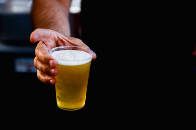 Close-up of hand holding drink