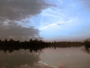 Scenic view of lake against sky during sunset