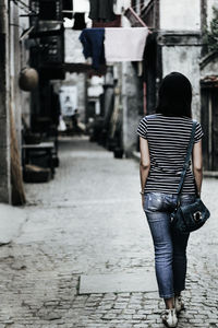 Rear view of woman standing outdoors