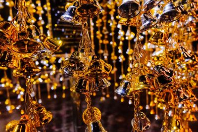 Close-up of golden wind chimes chandelier